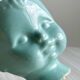 Cache-pot turquoise en forme de tête de poupée vintage