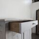 Small buffet with two doors and one drawer in white patinated wood.