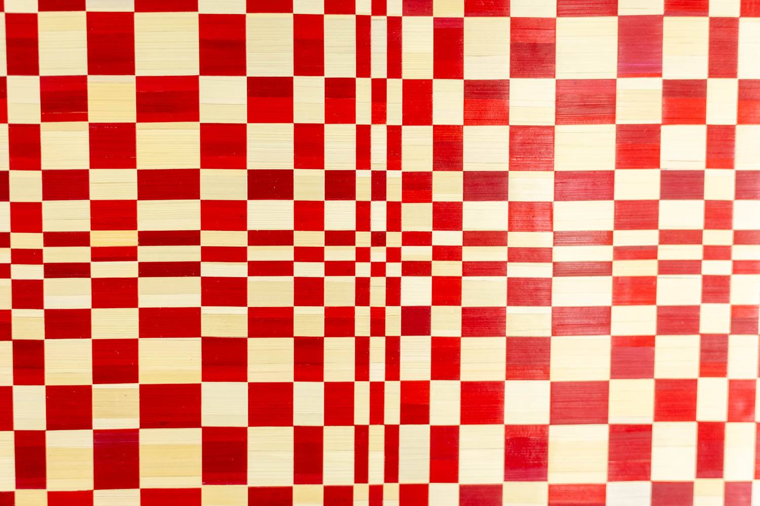 Pair of panels in red and gold straw marquetry. Contemporary.