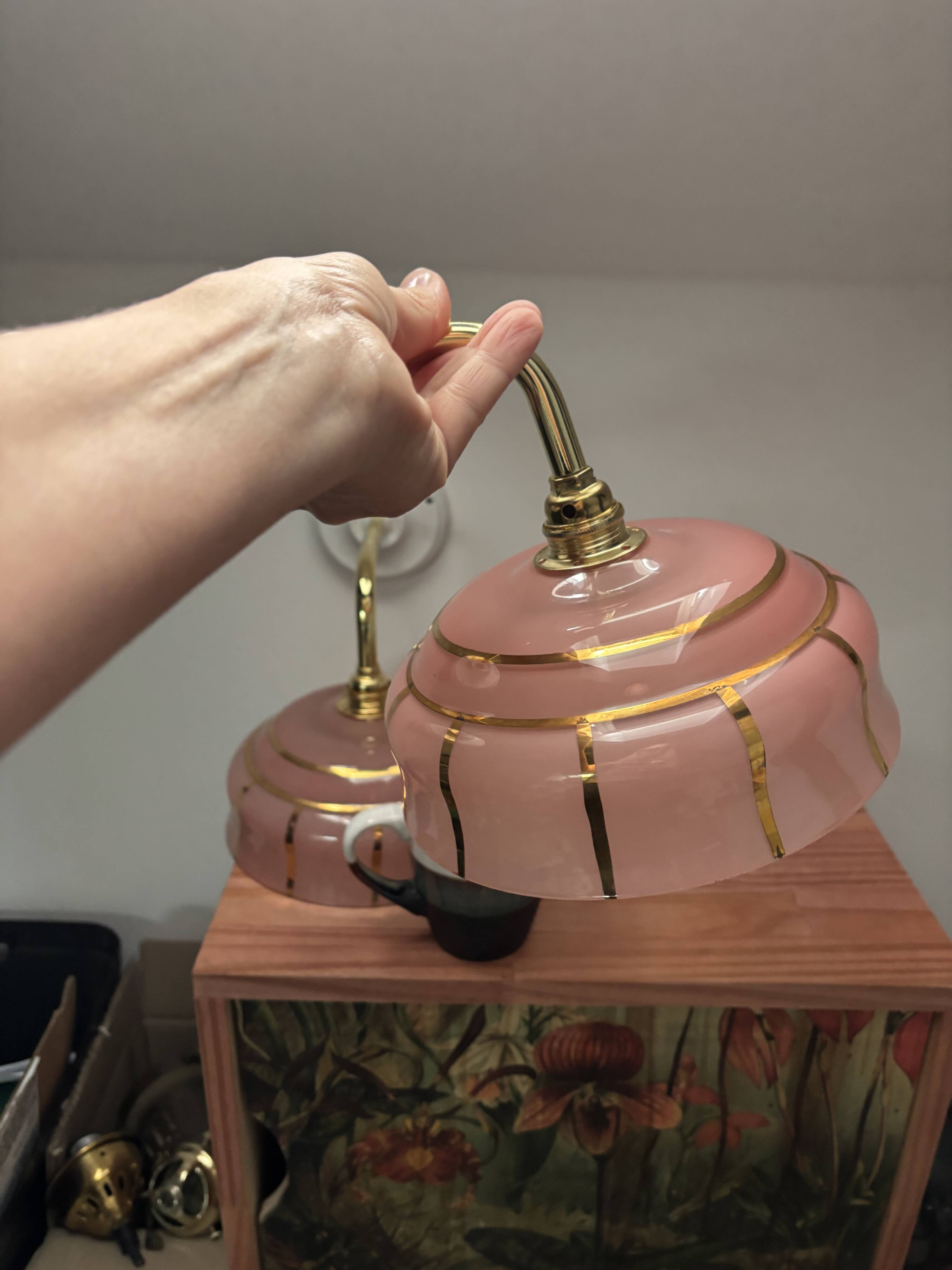Pair of white ceramic wall lights with pink glass