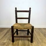 Pair of old wooden and straw children's chairs.