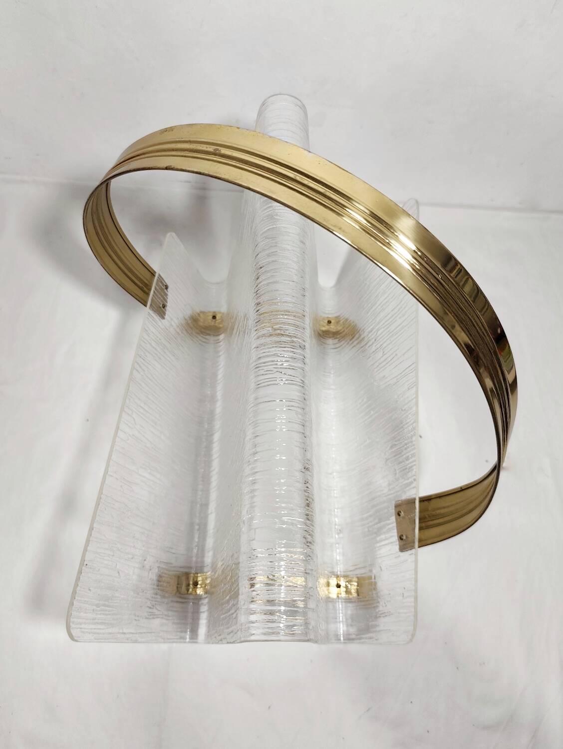 Revistero de metacrilato y latón. España, 1980s.