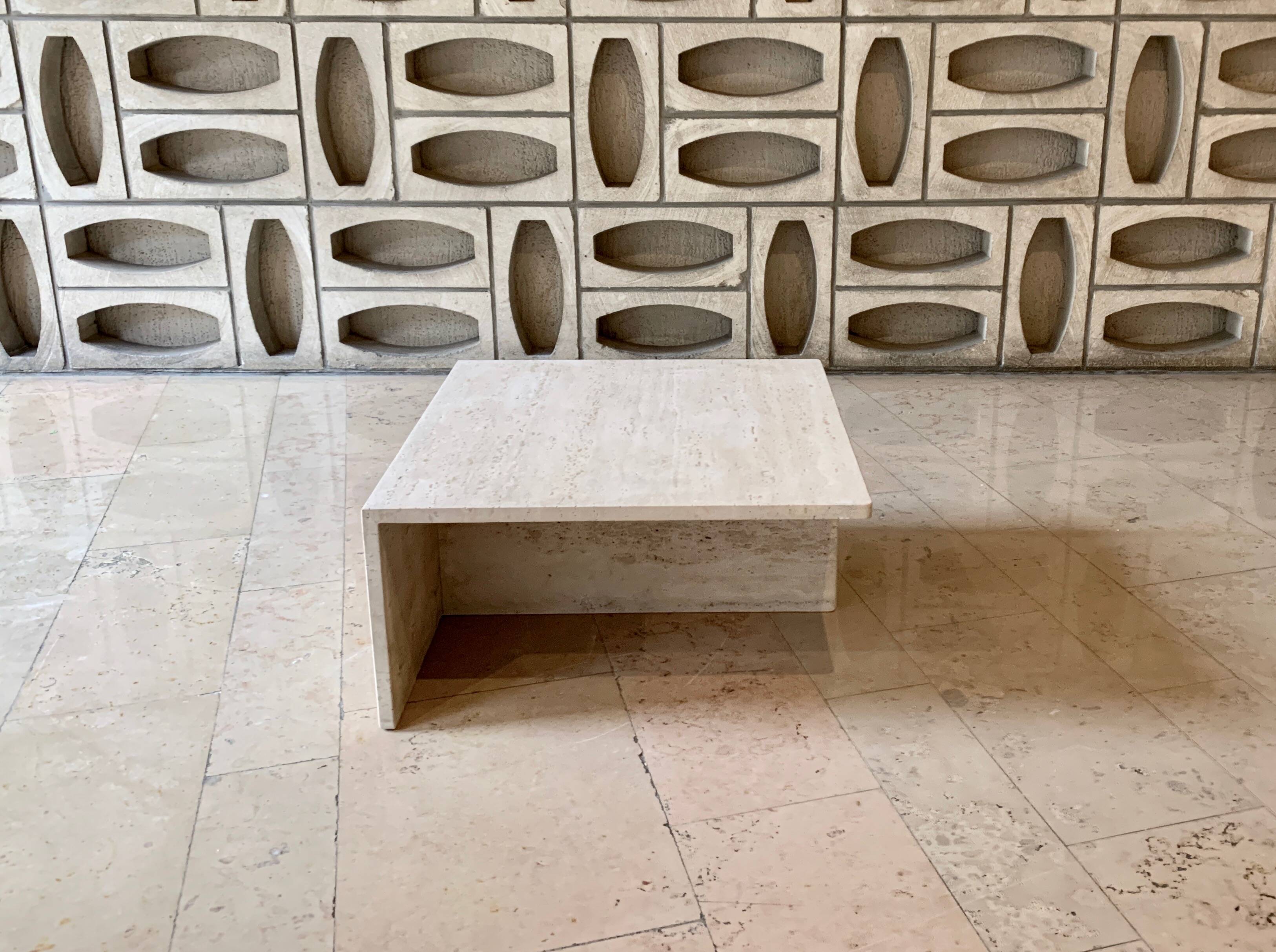 Square travertine coffee table by Giusti and Di Rosa for UP&UP.