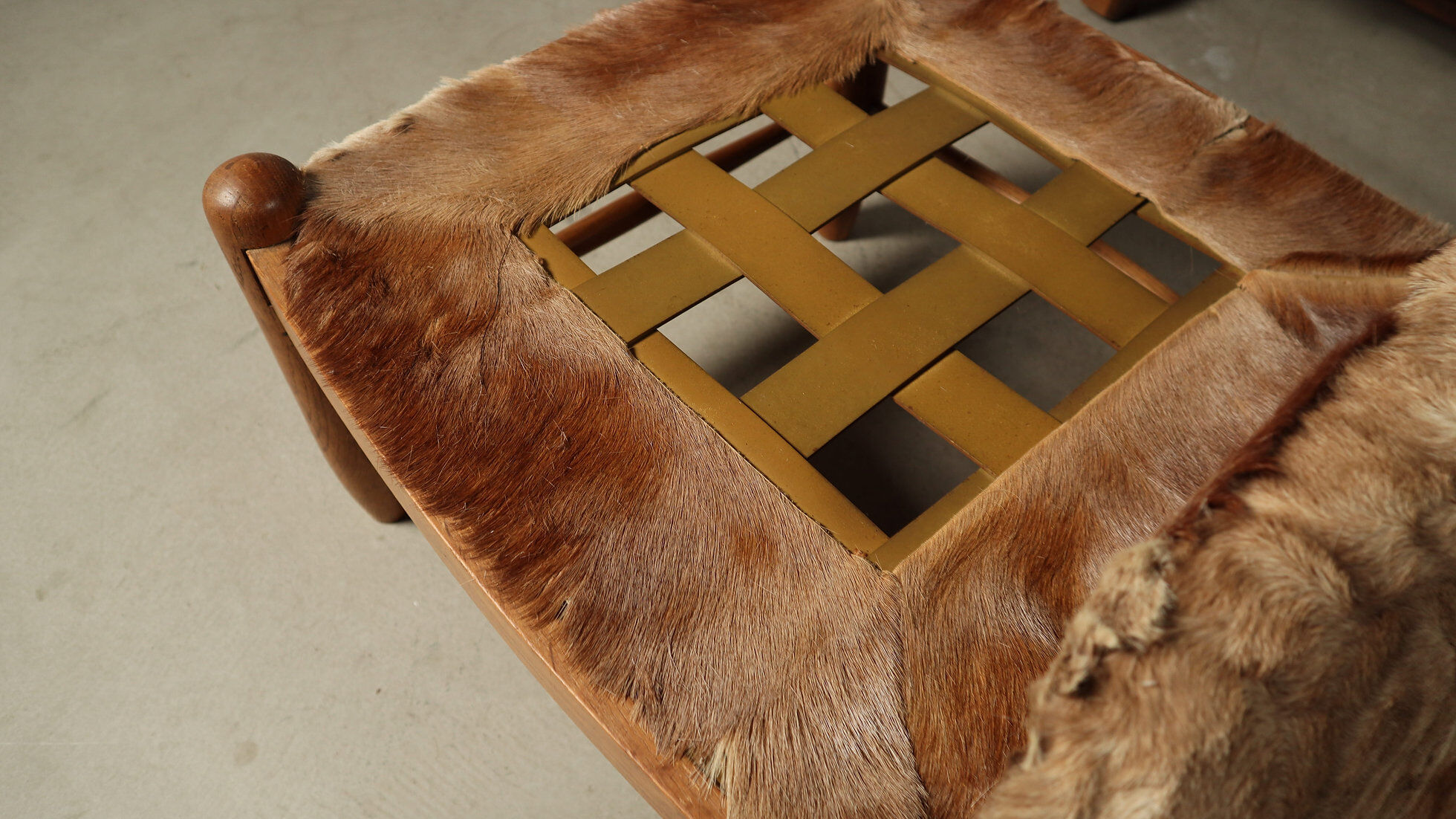 Brutalist oak lounge chair and ottoman in original goat hide, 1960s