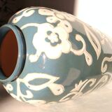Blue water vase with white floral pattern