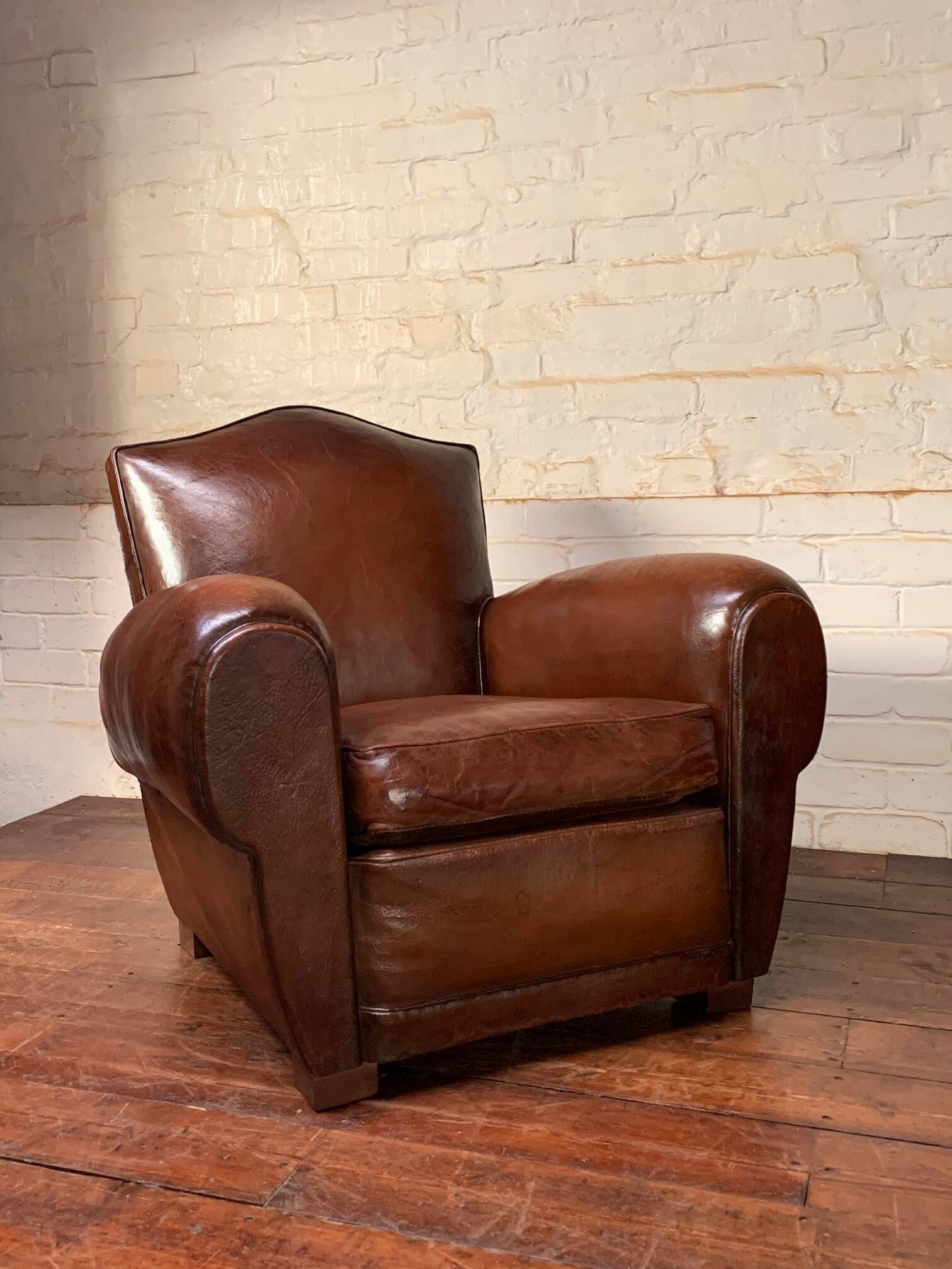 French leather club chair, chapeau de gendarme model circa 1950’s
