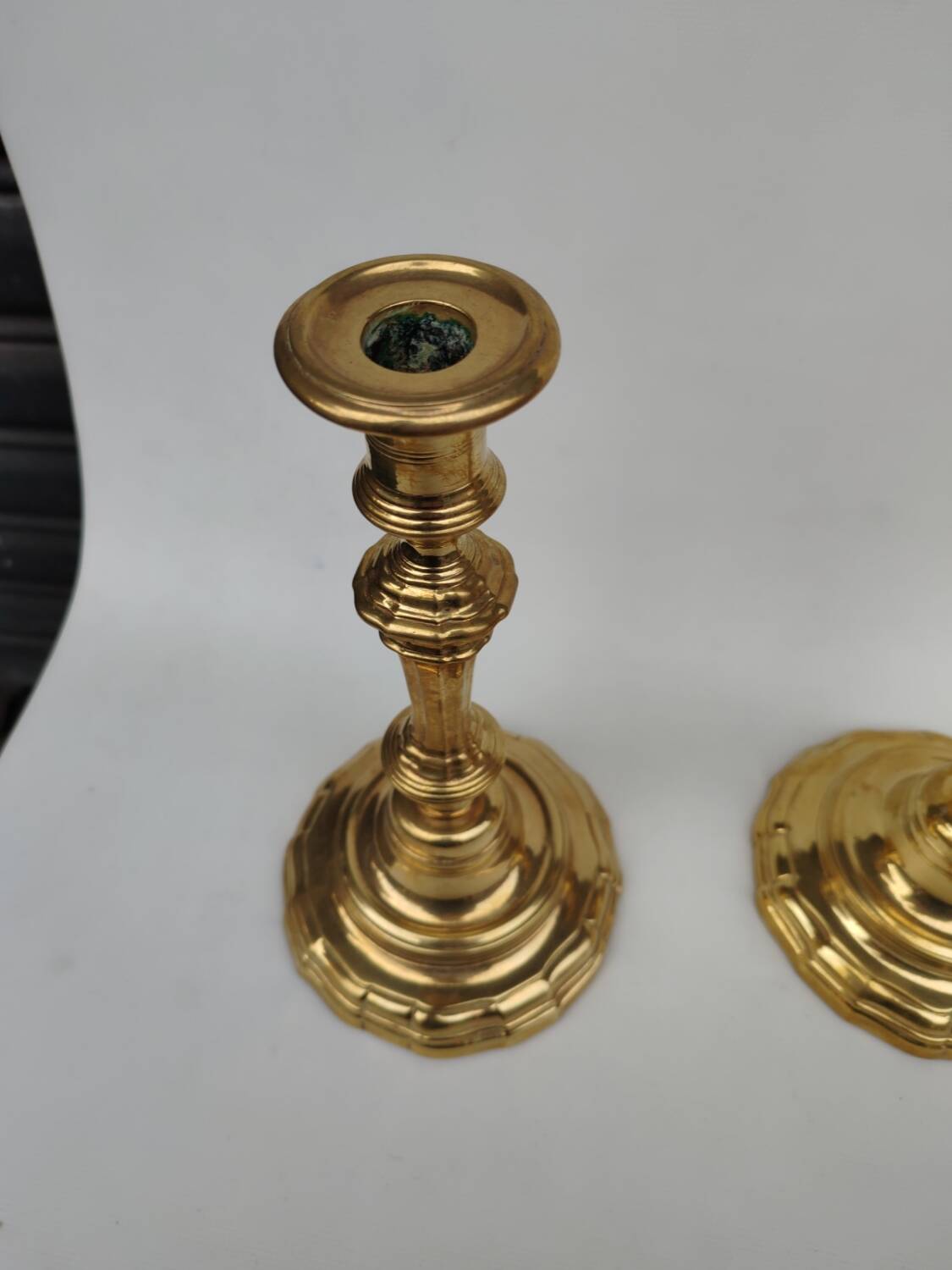 Pair of solid brass candlesticks, early 18th century.