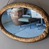 Art Deco oval mirror in gilded wood, France circa 1920