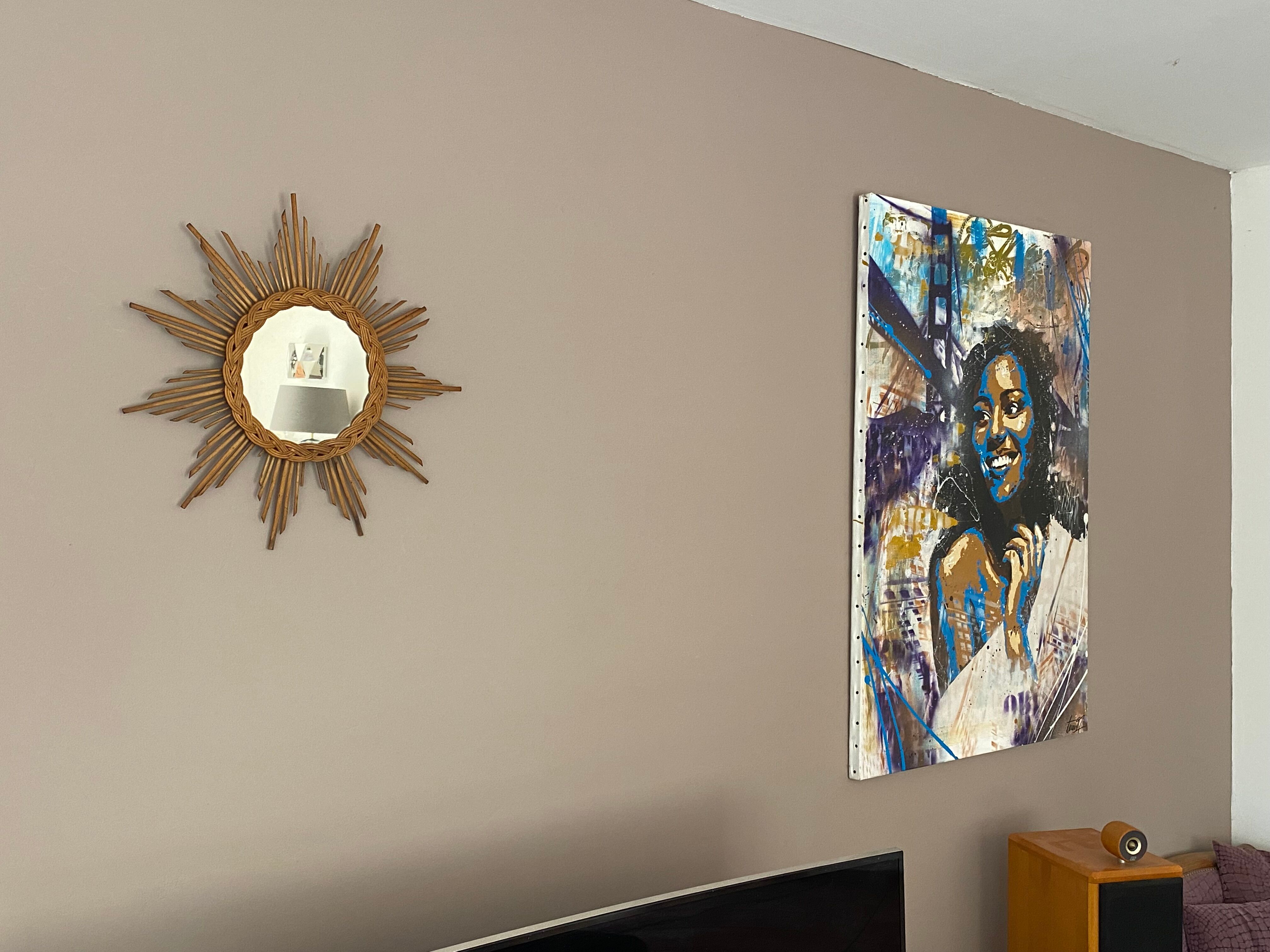 Sun mirror in braided rattan. 1960. 50cm.