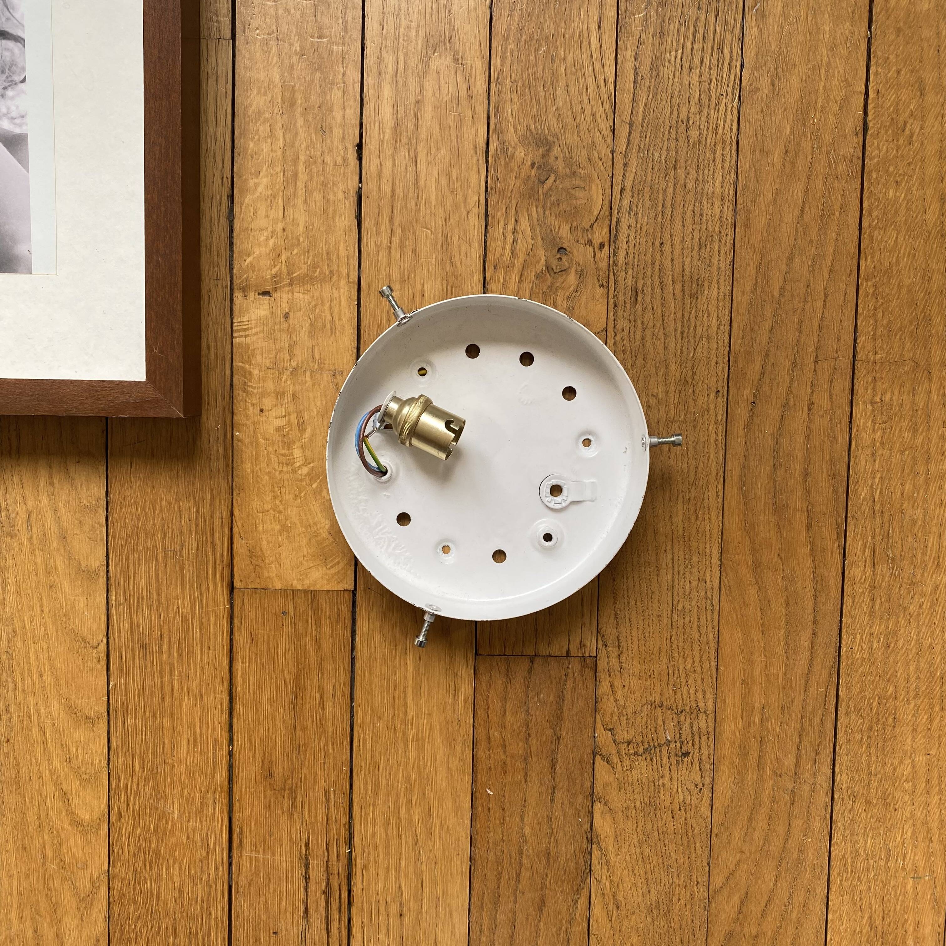Wall lamp or ceiling light with minimalist porthole glass.