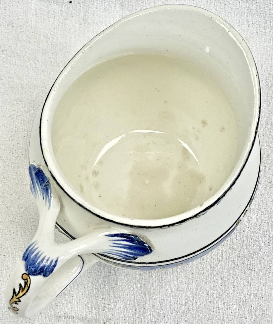Old cream jug for children at the Dionysos press Gien