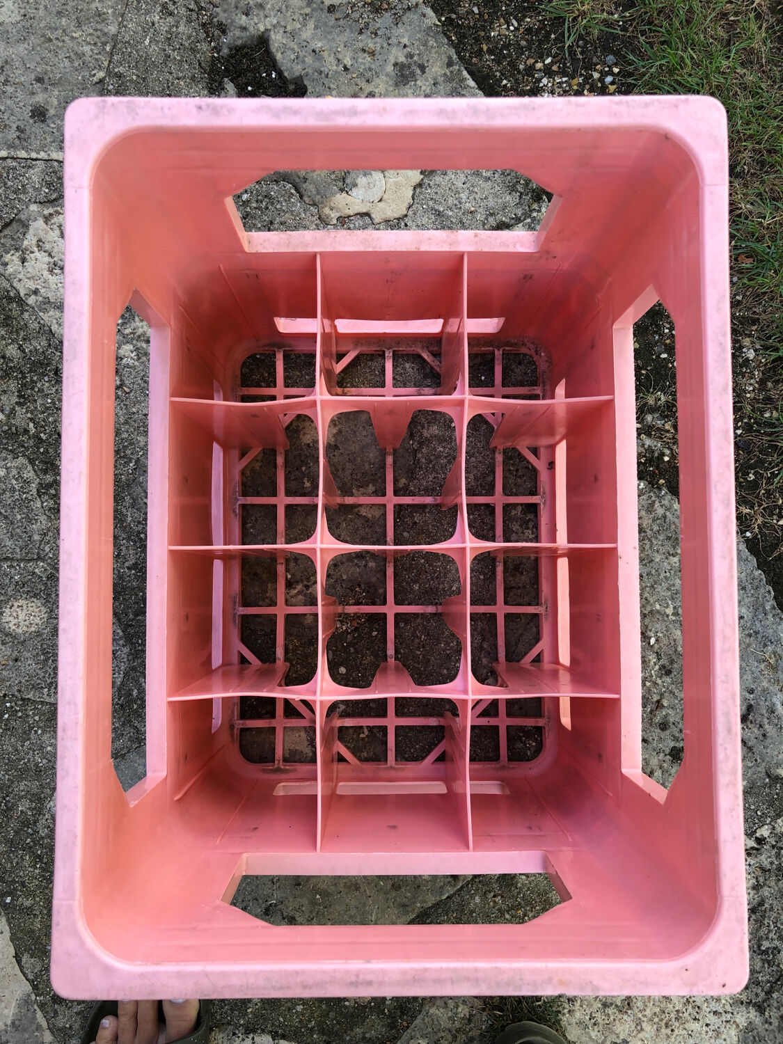 Evian bottle holder in pink plastic