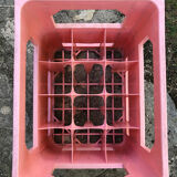 Evian bottle holder in pink plastic