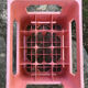 Evian bottle holder in pink plastic