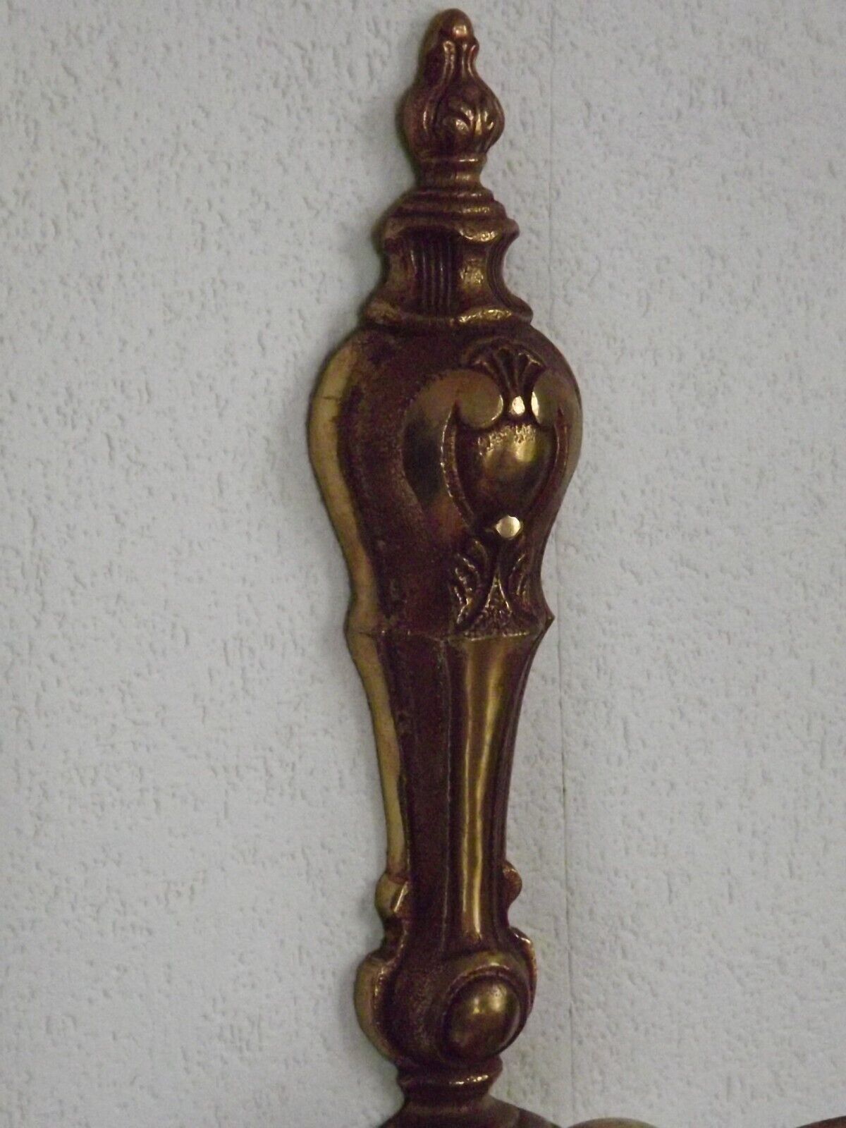 Simple wall sconce in classic Empire style in vintage French bronze.