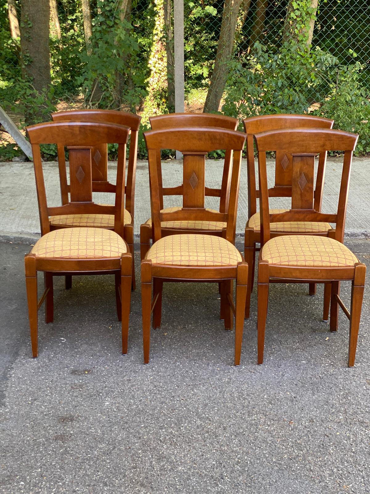 6 Syriel solid cherry wood dining chairs with yellow fabric.