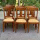 6 Syriel solid cherry wood dining chairs with yellow fabric.