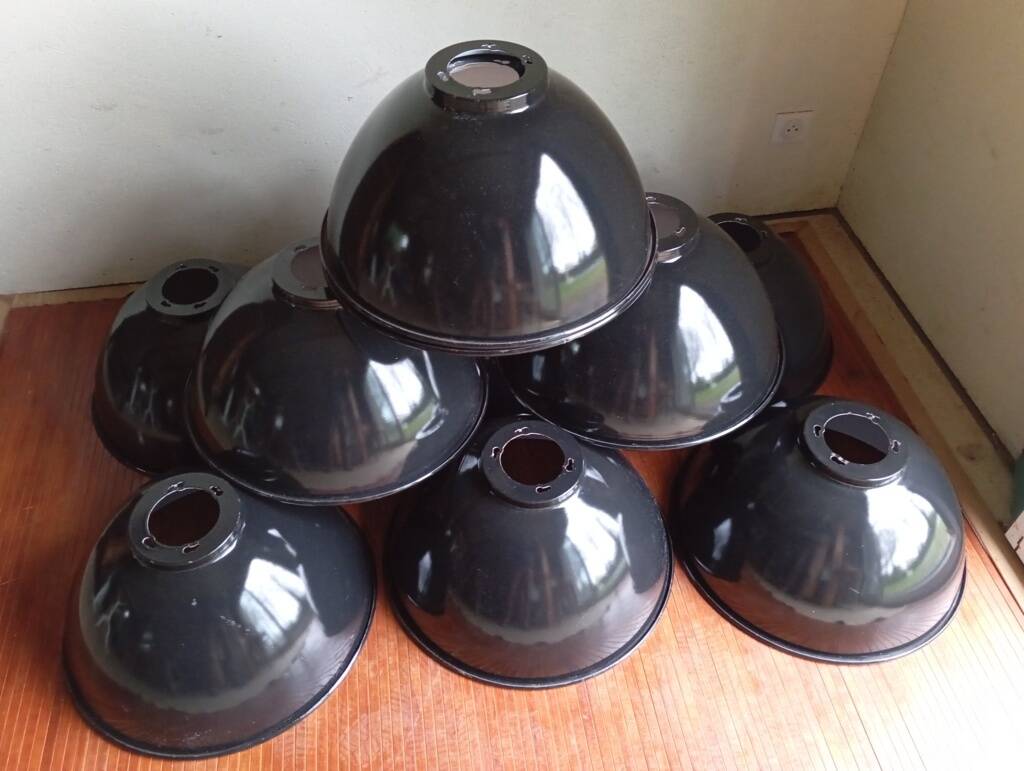 Set of 10 large industrial enamelled metal pendants.
