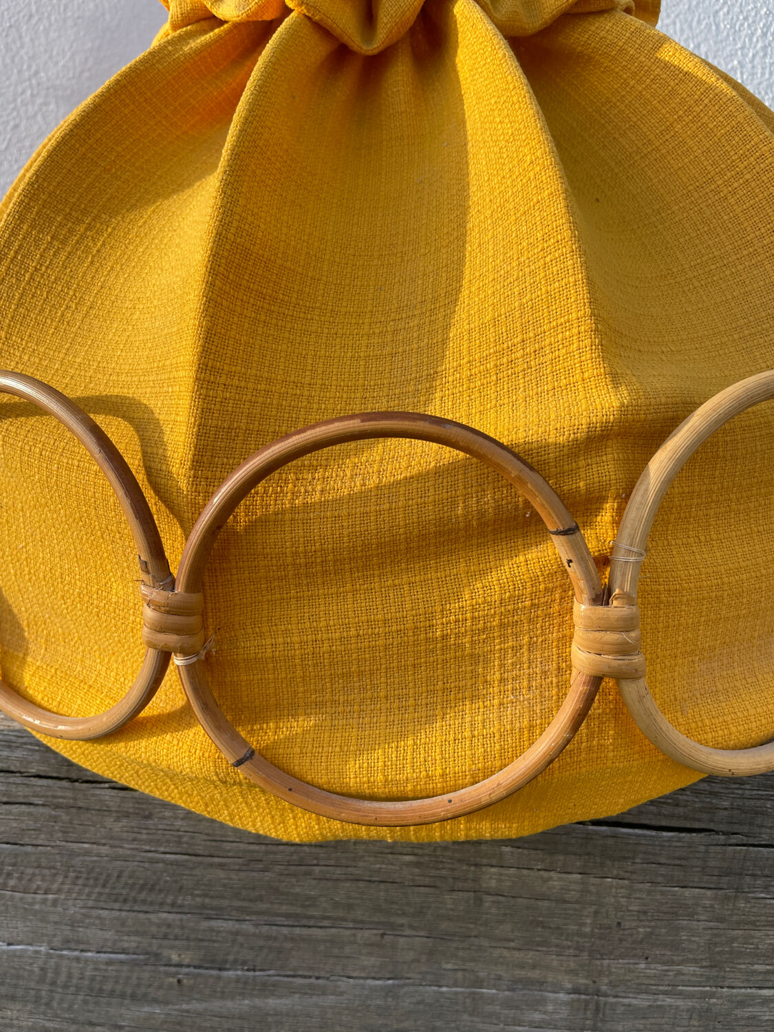 Wooden rattan and fabric suspension