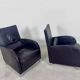 Pair of aubergine leather club armchairs by Cinna.