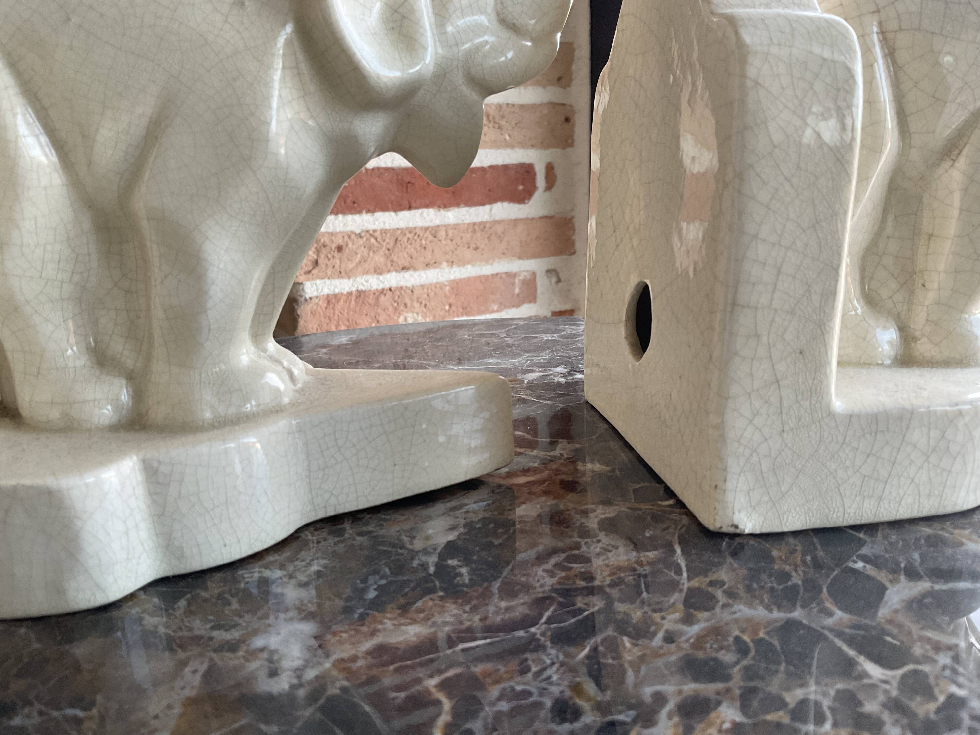 Pair of cracked earthenware bookends. ART DECO