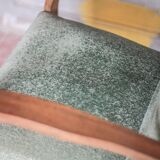 Art Deco armchair in wood and green fabric, living room armchair, interior decor.