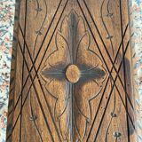 Low stool in carved wood