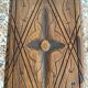 Low stool in carved wood