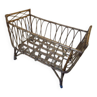 Old rattan baby bed