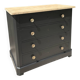 Antique commode with a matte black finish.