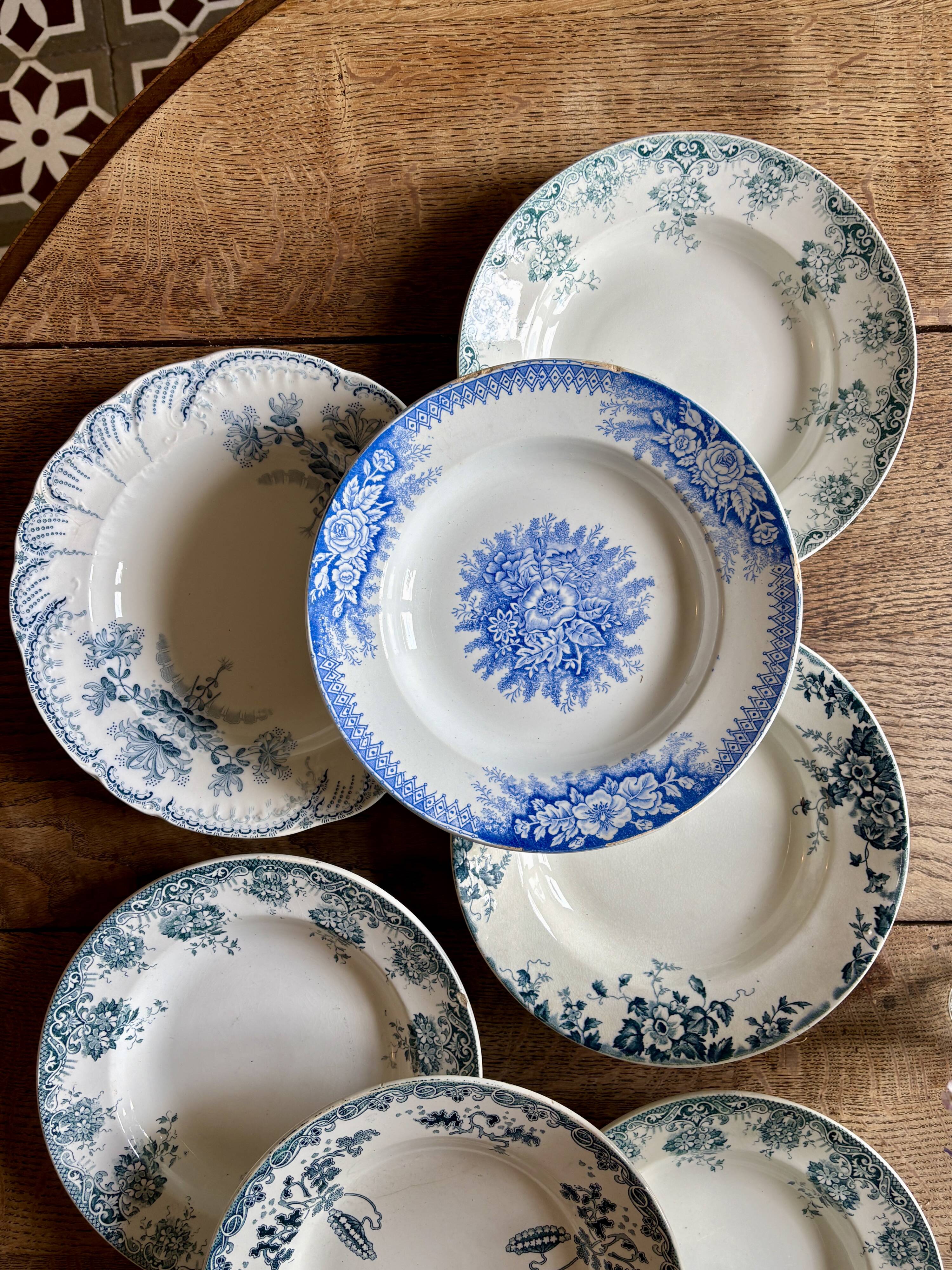 Set of 8 mismatched antique ironstone deep plates.