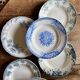 Set of 8 mismatched antique ironstone deep plates.