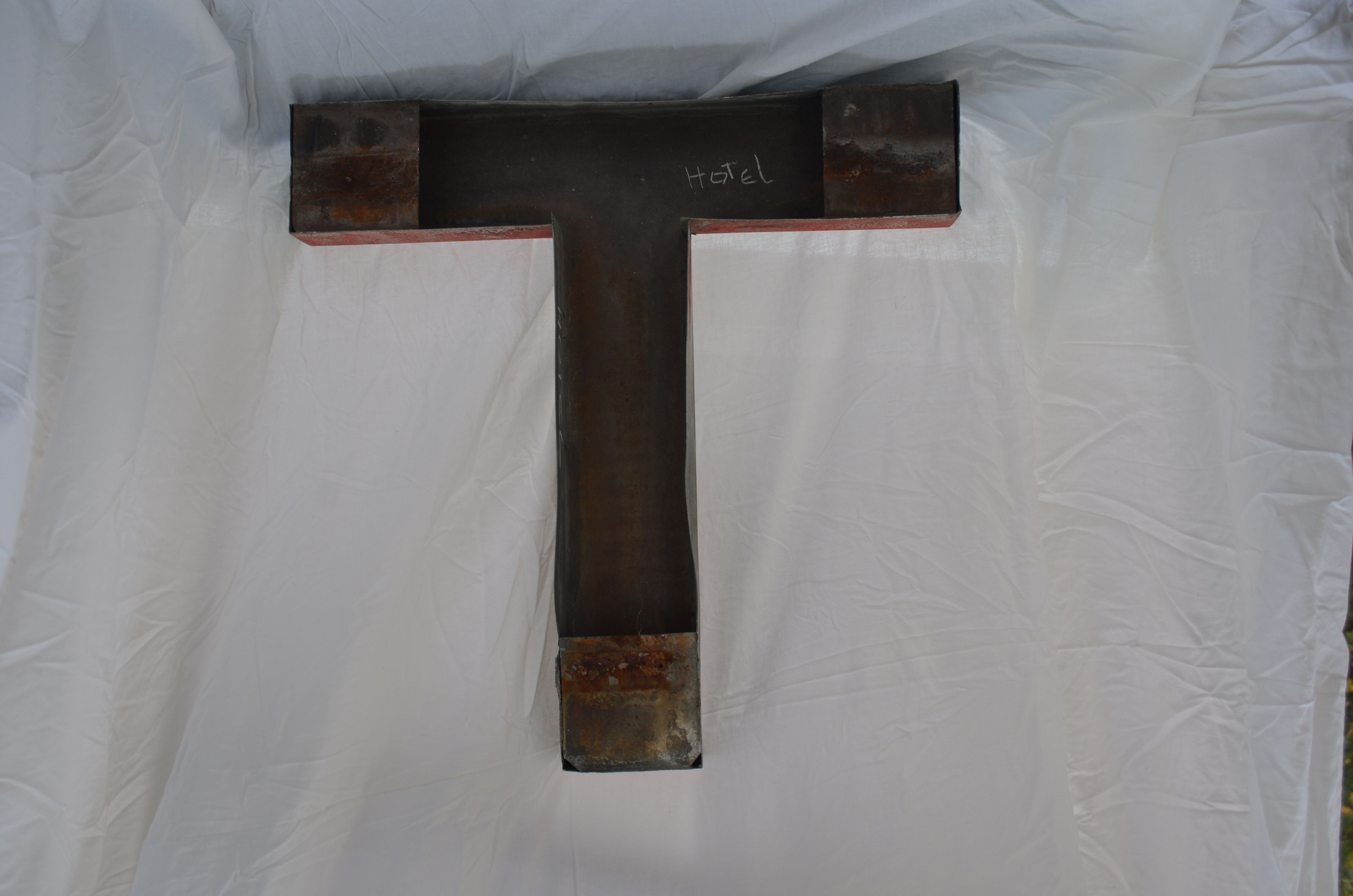 Letter of sign in ancient zinc T