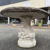 Pretty round table in reconstituted stone