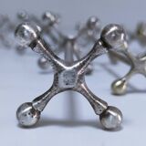 Eleven 70s design metal "crosshair" knife holders