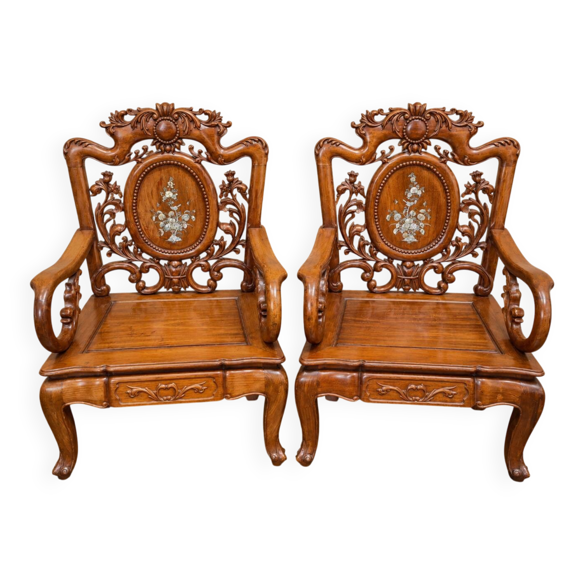 Pair of Asian armchairs in carved wood with mother-of-pearl inlays.
