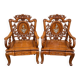 Pair of Asian armchairs in carved wood with mother-of-pearl inlays.