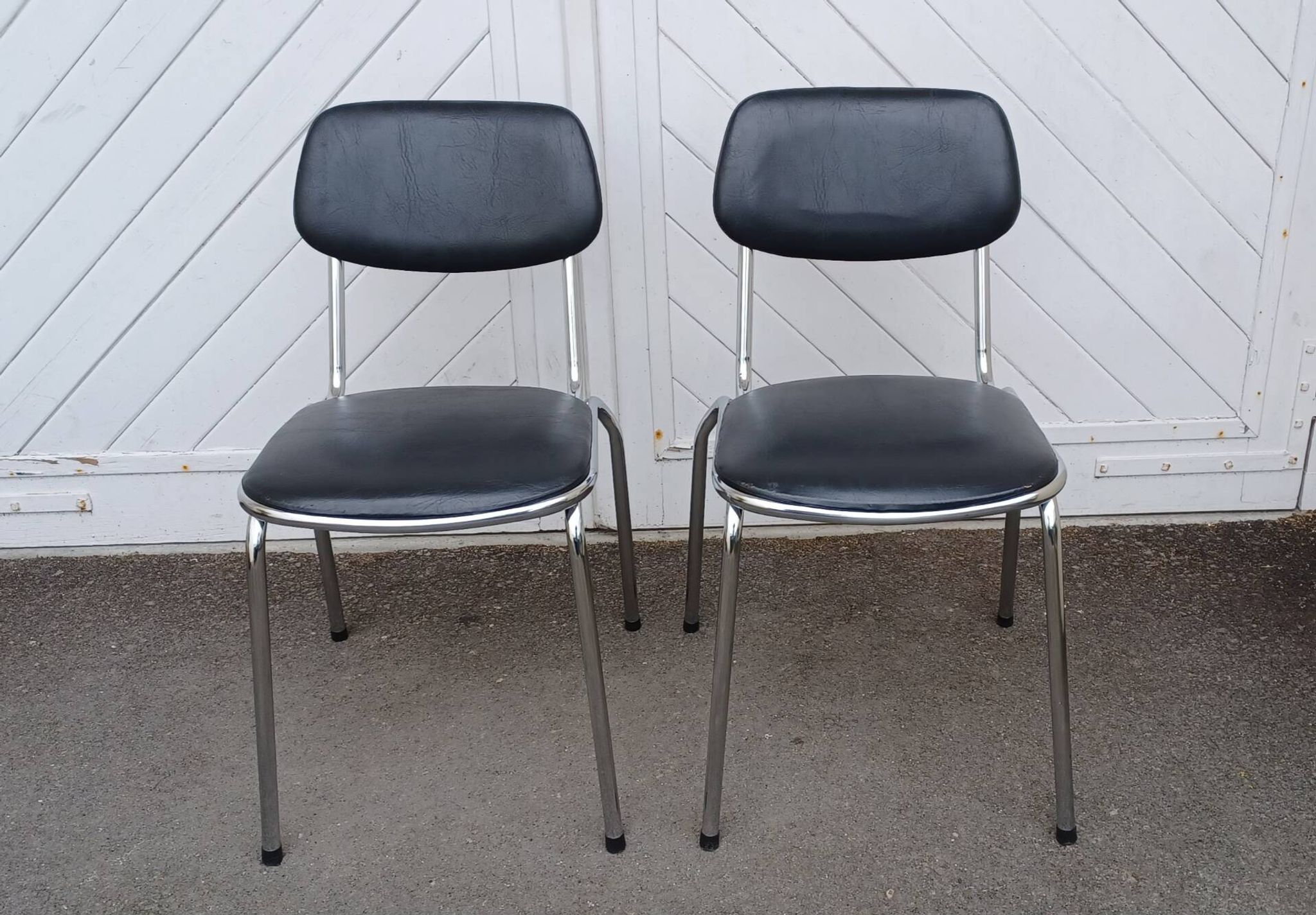Pair of vintage faux leather and chrome chairs