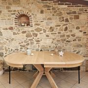 Round table in the style of Pierre Chapo.