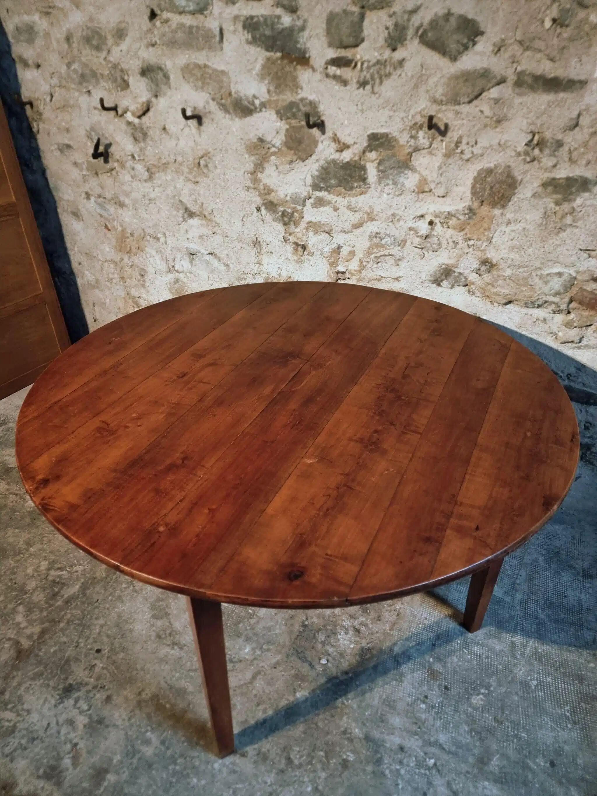 Vintage French round dining table in cherry wood, circa 1920.