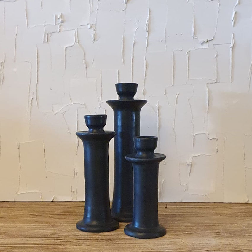 Set of three candlesticks in black tadelakt