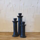 Set of three candlesticks in black tadelakt