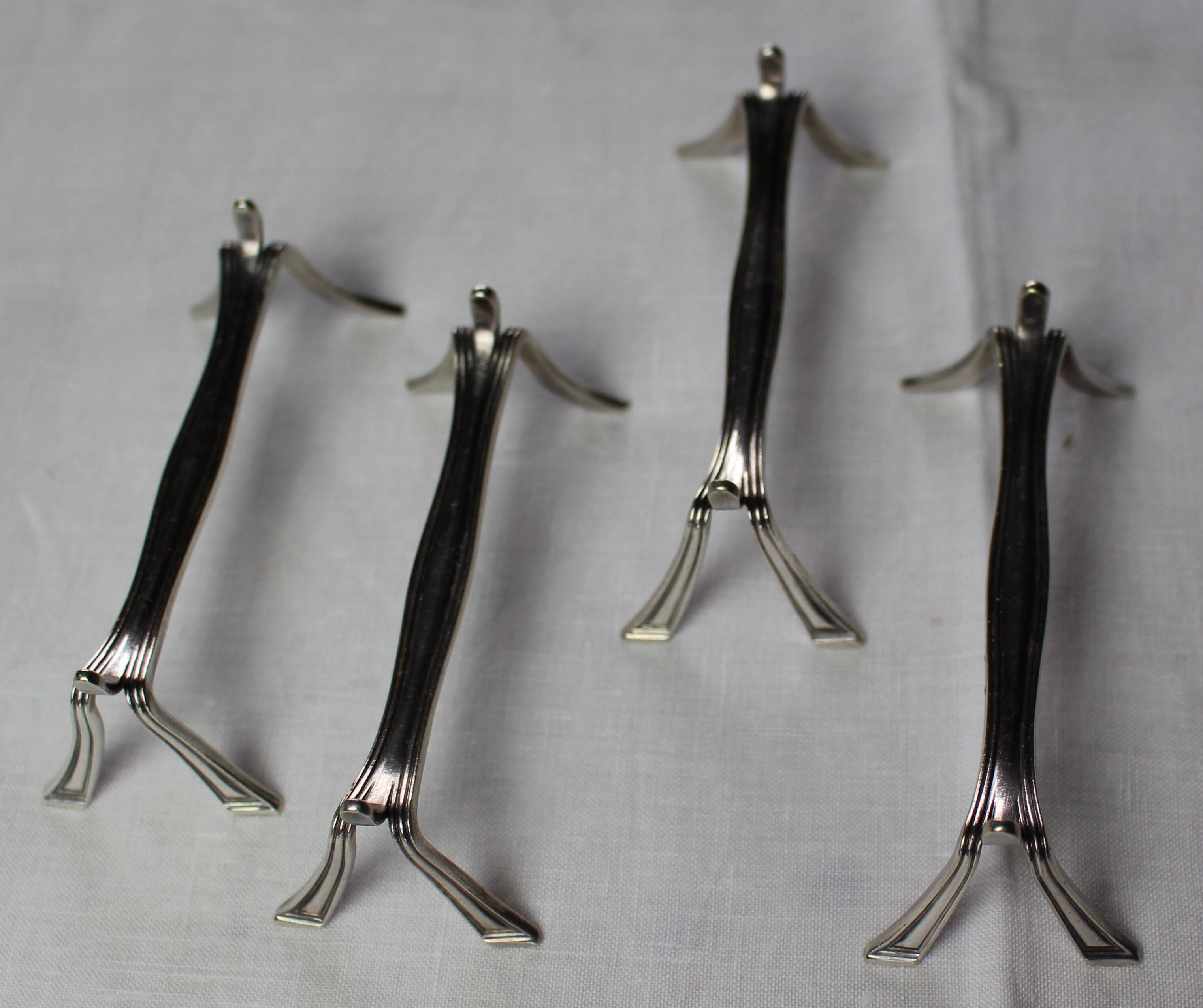 Lot of 4 silver metal knife holders "Christofle"