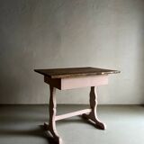 Rustic pink painted desk with brown tabletop