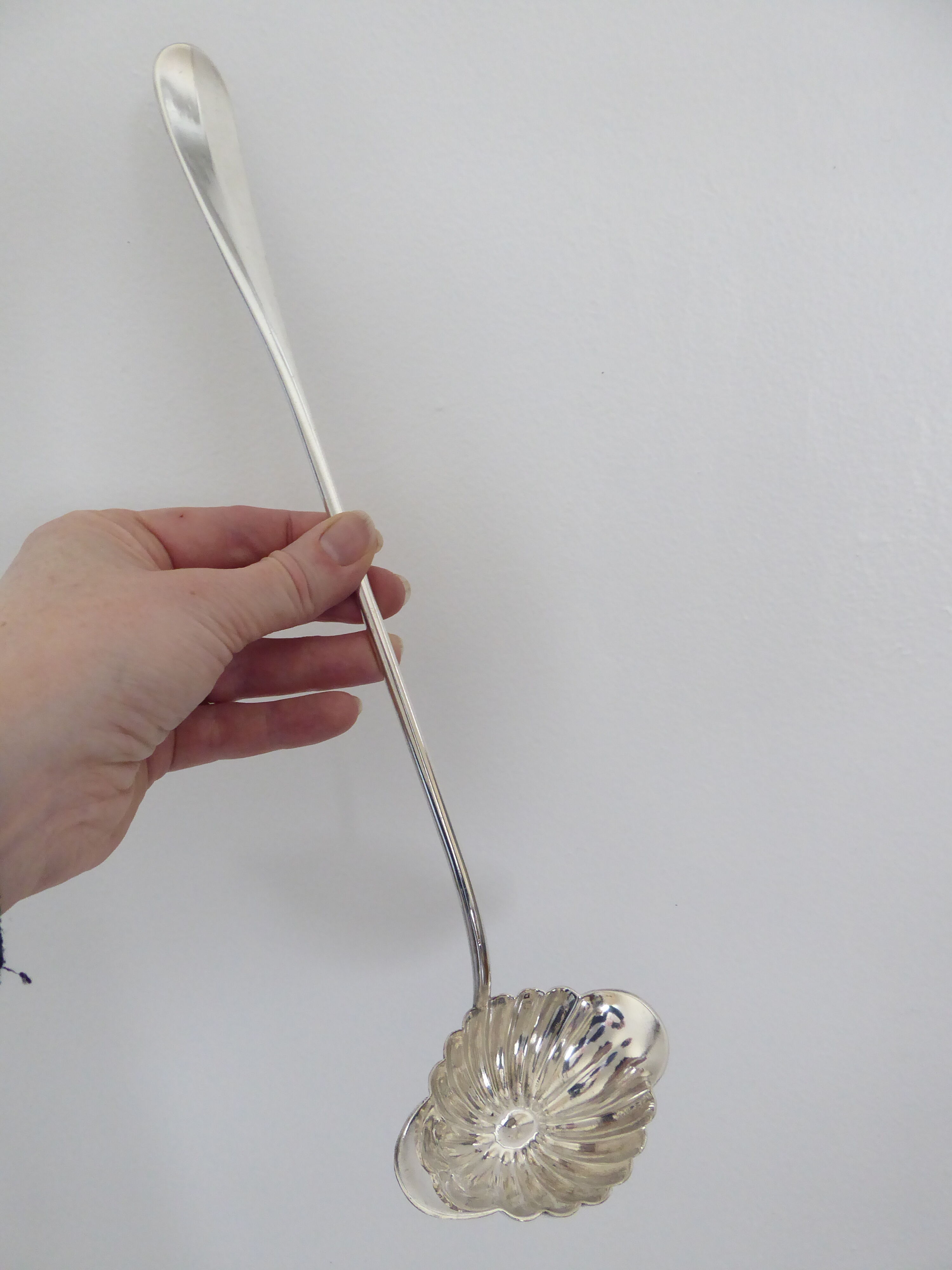 Silver metal sauce ladle