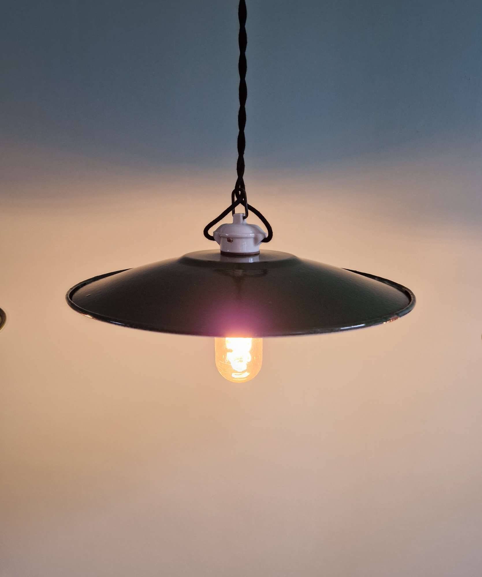 Trio of large industrial suspensions in green enamelled sheet metal.