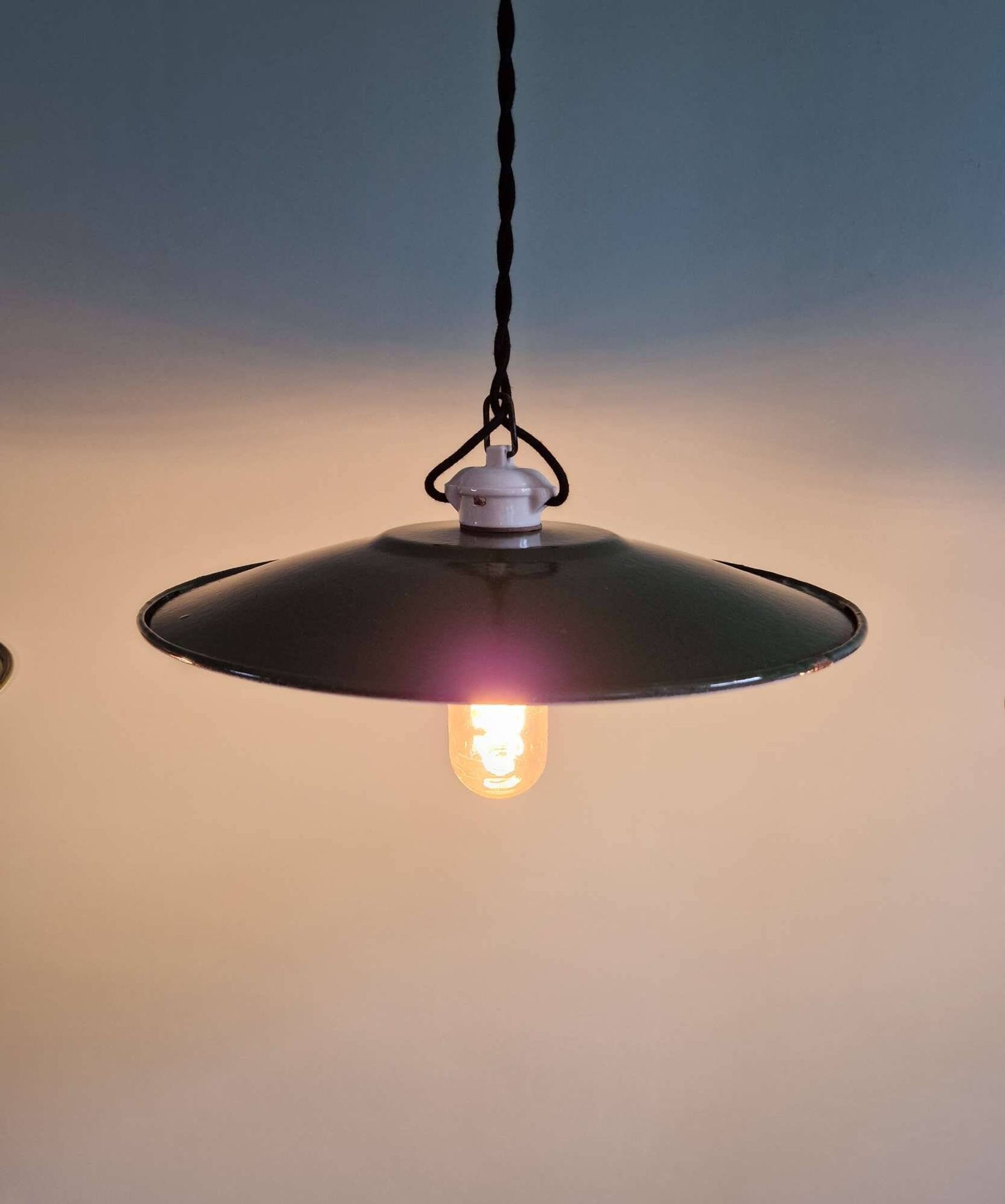 Trio of large industrial suspensions in green enamelled sheet metal.