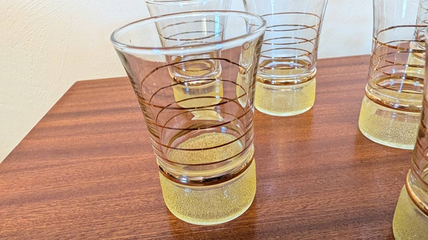 70s vintage glass with gold decoration and a speckled base.