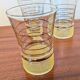 70s vintage glass with gold decoration and a speckled base.
