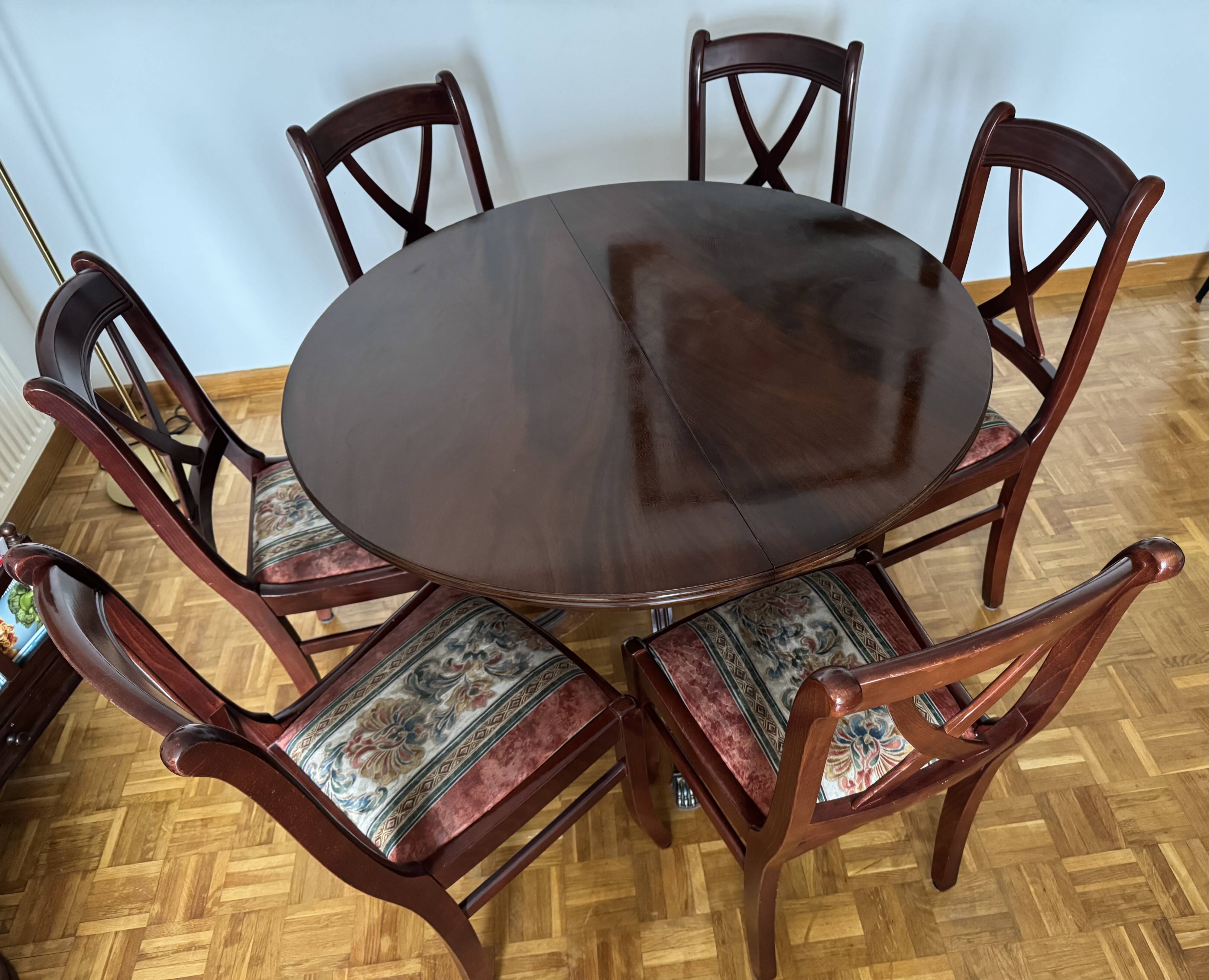 Round mahogany table and beech chairs.